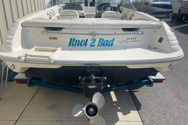 Slide: The Image of 1996 Sea Ray 210 Bow Rider boat with "Knot 2 Bad" name on the stern. - 3
