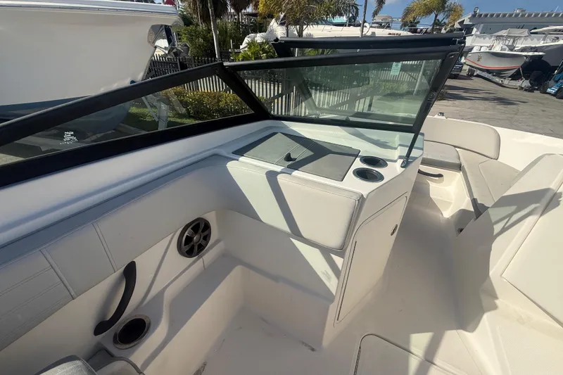 Slide: The Image of 2020 Sea Ray SPX 210 Outboard boat interior with seating and windshield. - 13