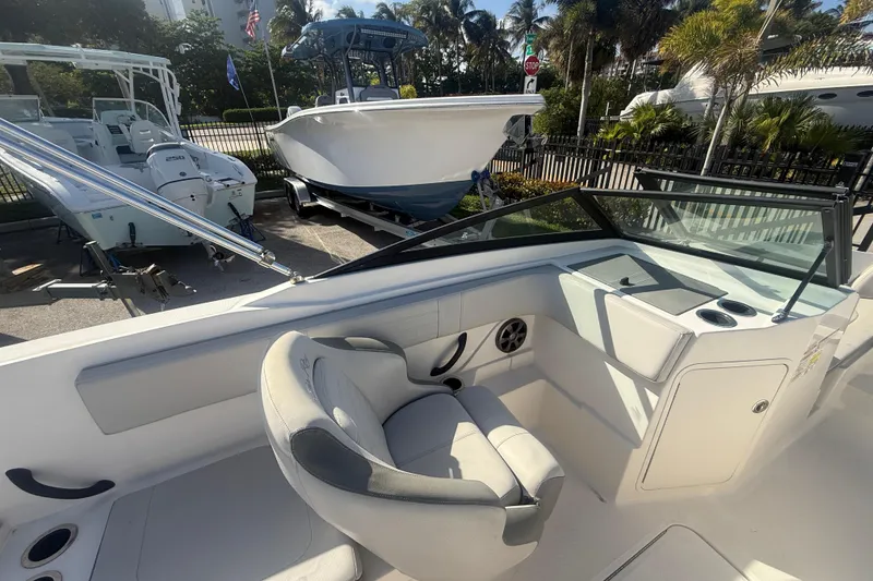 Slide: The Image of 2020 Sea Ray SPX 210 Outboard boat interior with helm and seating area. - 14