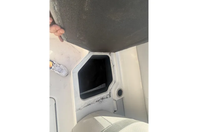 Slide: The Image of Storage compartment on a 2020 Sea Ray SPX 210 Outboard boat, open for viewing. - 20