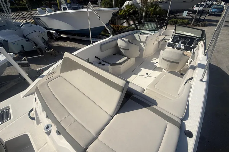Slide: The Image of 2020 Sea Ray SPX 210 Outboard boat interior with spacious seating and modern dashboard. - 5