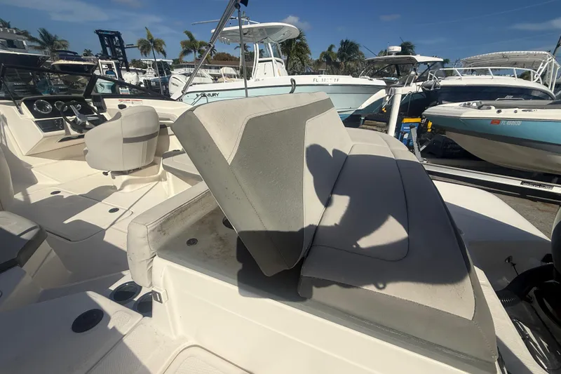 Slide: The Image of 2020 Sea Ray SPX 210 Outboard boat interior with seating and steering wheel. - 8