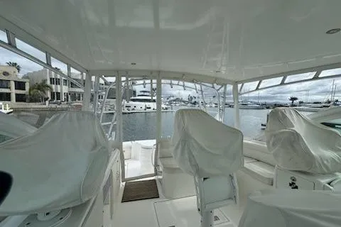 Slide: The Image of Interior view of a 2008 Cabo 40 Express yacht docked at a marina. - 17