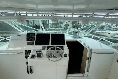 Slide: The Image of Helm of 2008 Cabo 40 Express yacht with modern navigation equipment. - 18