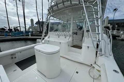 Slide: The Image of 2008 Cabo 40 Express yacht with spacious deck and modern amenities in marina setting. - 21