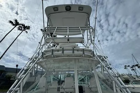 Slide: The Image of 2008 Cabo 40 Express boat with tower against cloudy sky backdrop. - 23