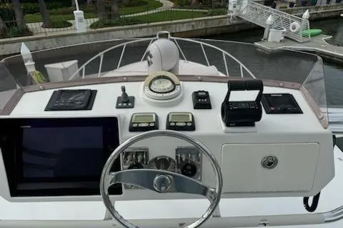 Slide: The Image of Helm of 2008 Cabo 40 Express boat with navigation instruments and steering wheel. - 24