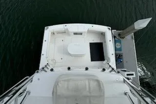 Slide: The Image of 2008 Cabo 40 Express boat docked, aerial view of deck and water. - 28