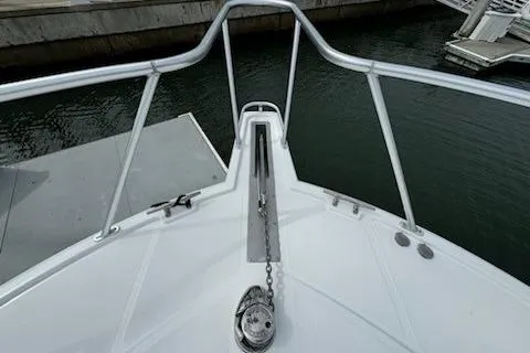 Slide: The Image of Bow view of 2008 Cabo 40 Express boat docked at marina. - 30