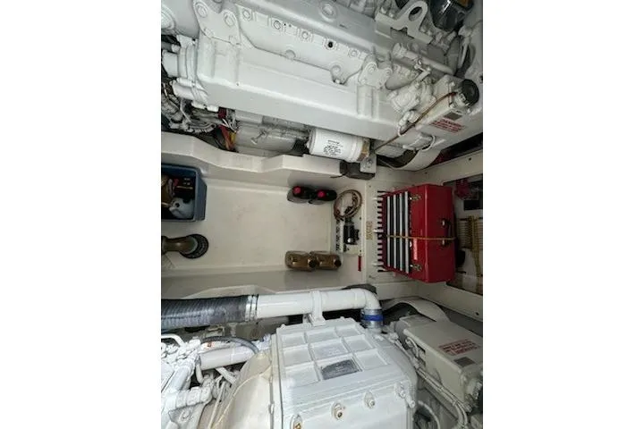 Slide: The Image of Engine room of 2008 Cabo 40 Express boat, showcasing mechanical components and systems. - 33