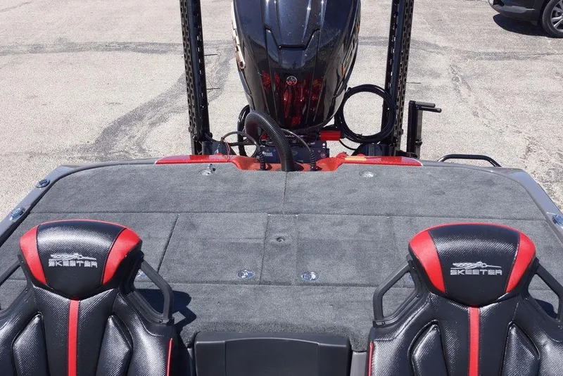 Slide: The Image of 2026 Skeeter ZXE21 boat interior with dual seats and motor, showcasing sleek design. - 12