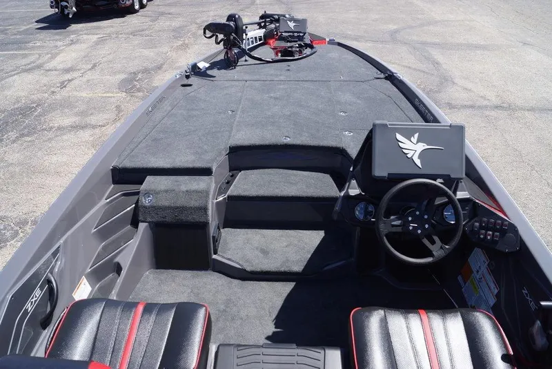 Slide: The Image of 2026 Skeeter ZXE21 boat interior with steering wheel and control panel. - 14