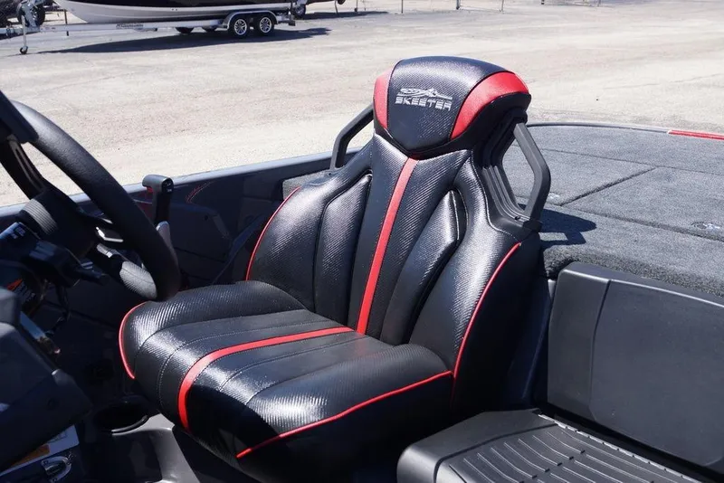 Slide: The Image of Luxurious Skeeter ZXE21 boat seat, 2026 model, featuring sleek black and red design. - 15