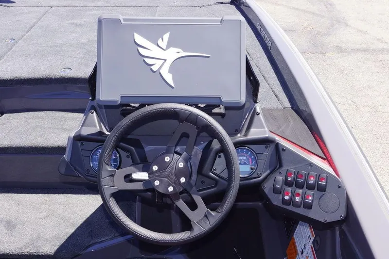 Slide: The Image of 2026 Skeeter ZXE21 boat dashboard with steering wheel and control panel. - 16