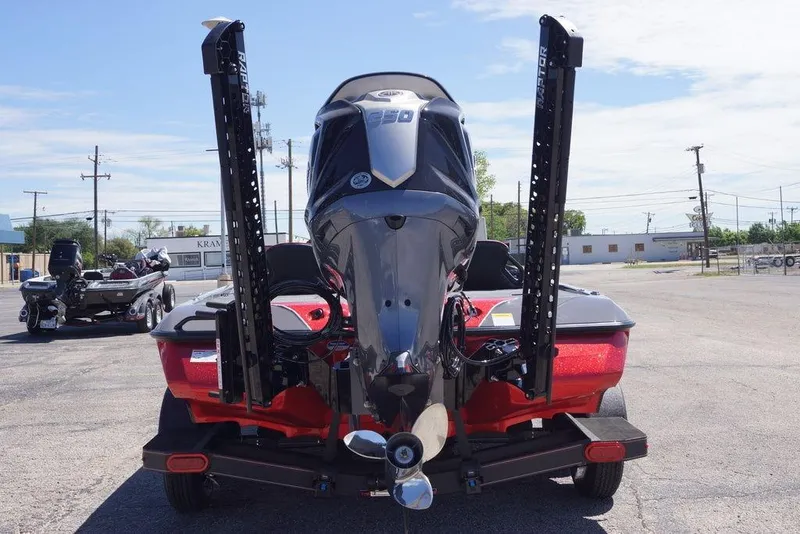Slide: The Image of 2026 Skeeter ZXE21 boat with powerful outboard motor, parked on a trailer in a lot. - 6