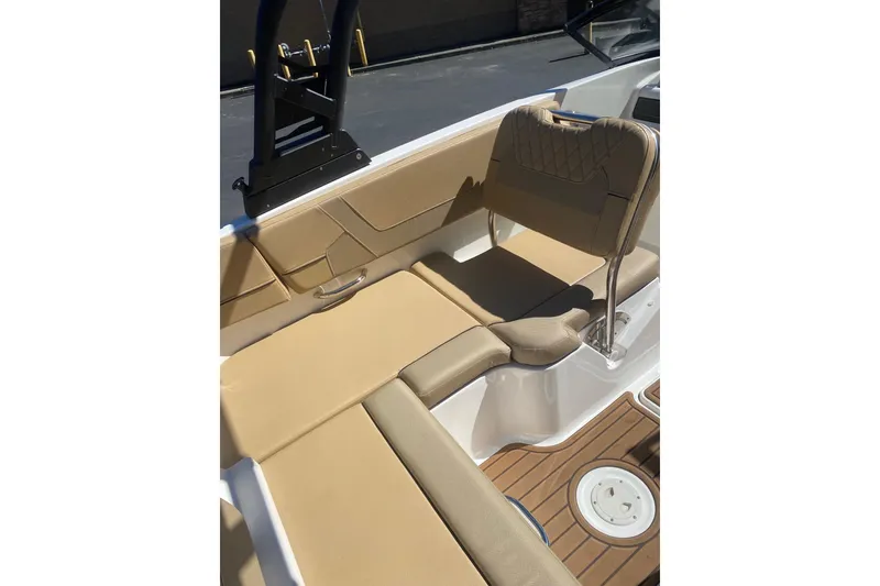 Slide: The Image of 2023 Bayliner VR5 Bowrider I/O interior with tan seating and sleek design. - 3