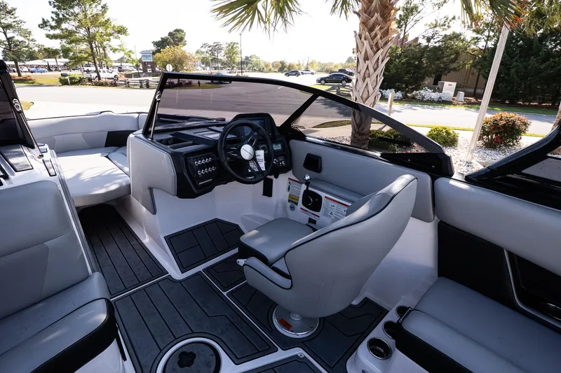 Slide: The Image of 2022 Moomba Max boat interior with sleek seating and modern dashboard design. - 10