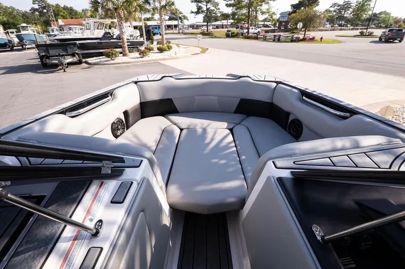 Slide: The Image of 2022 Moomba Max boat interior with spacious seating and modern design. - 13