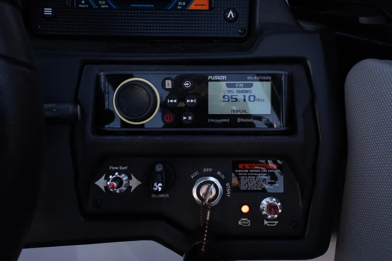 Slide: The Image of 2022 Moomba Max dashboard with Fusion stereo system and ignition controls. - 15