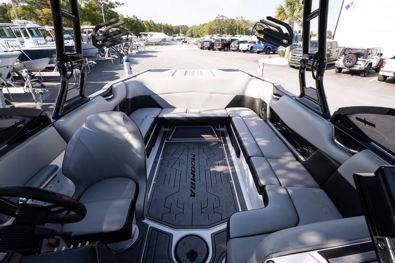 Slide: The Image of 2022 Moomba Max boat interior with spacious seating and modern design. - 8