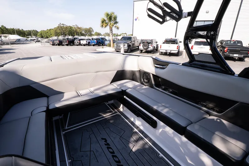 Slide: The Image of 2022 Moomba Max boat interior with gray seating and modern design. - 9