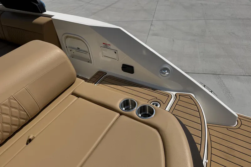 Slide: The Image of Luxurious seating and cup holders on 2021 Sea Ray SLX 280 boat deck. - 11