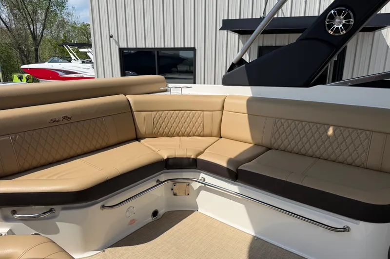 Slide: The Image of Luxurious seating on 2021 Sea Ray SLX 280 boat with tan upholstery. - 12