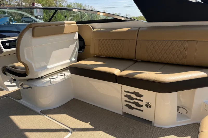 Slide: The Image of Luxurious interior of 2021 Sea Ray SLX 280 boat with tan leather seating. - 13