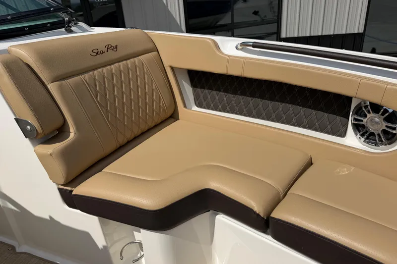 Slide: The Image of Luxurious tan seating on 2021 Sea Ray SLX 280 boat, featuring diamond stitching and speaker. - 14