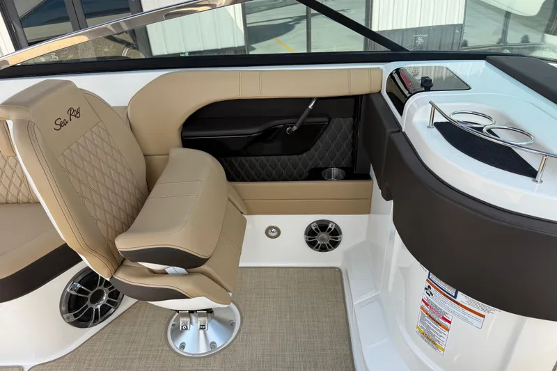 Slide: The Image of Luxurious interior of 2021 Sea Ray SLX 280 boat with tan seating and cup holders. - 16