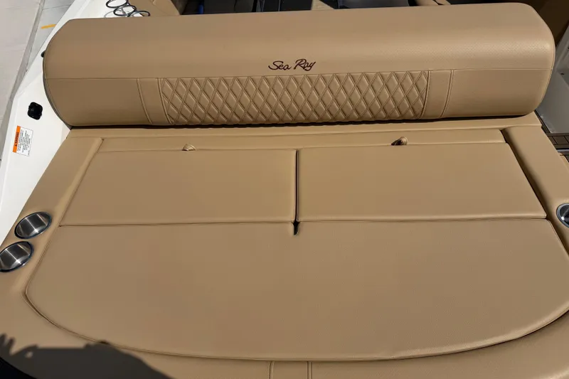 Slide: The Image of 2021 Sea Ray SLX 280 boat with tan leather seating and cup holders. - 17