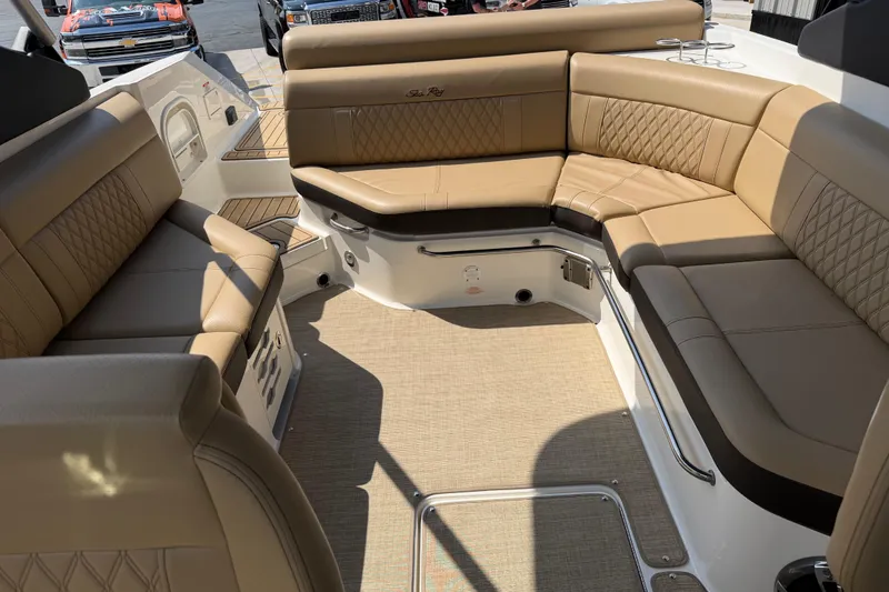 Slide: The Image of Luxurious interior of 2021 Sea Ray SLX 280 boat with tan leather seating. - 19