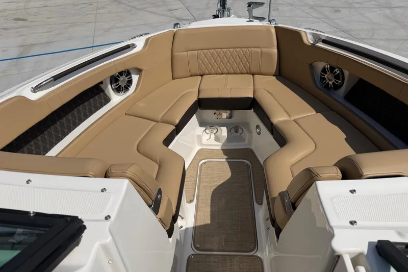 Slide: The Image of Luxurious seating area on a 2021 Sea Ray SLX 280 boat with tan upholstery. - 20