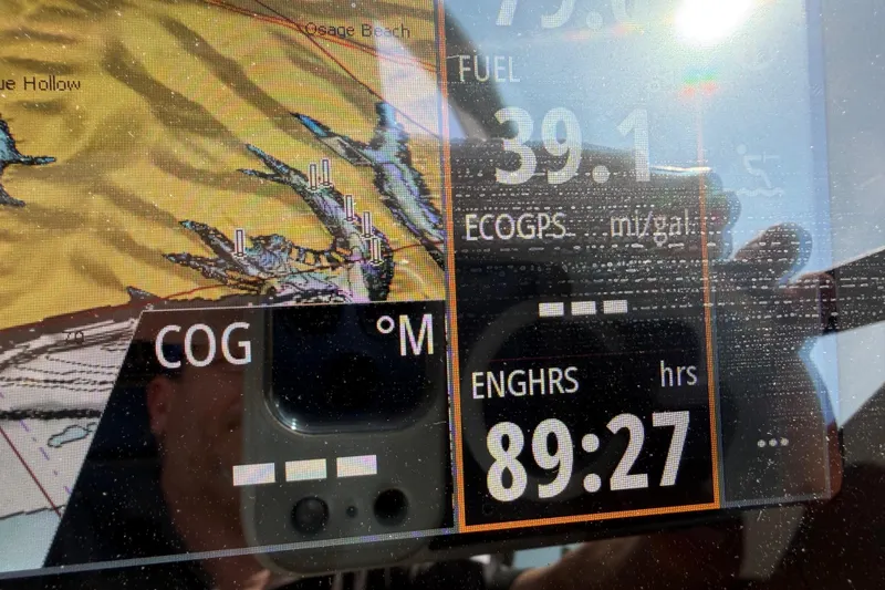 Slide: The Image of Boat navigation display showing fuel level and engine hours on Sea Ray SLX 280. - 22