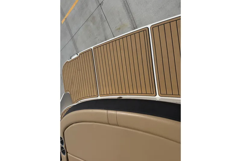 Slide: The Image of 2021 Sea Ray SLX 280 boat deck with tan and black accents. - 26