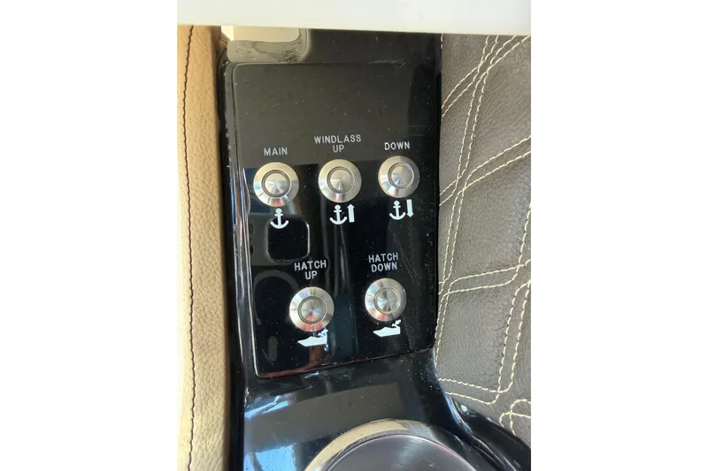 Slide: The Image of Control panel of a 2021 Sea Ray SLX 280 boat with windlass and hatch buttons. - 27