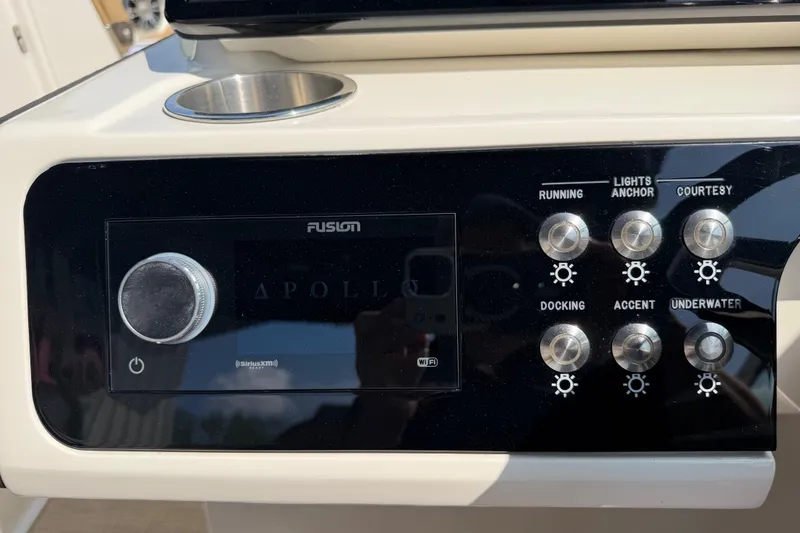 Slide: The Image of Control panel of a 2021 Sea Ray SLX 280 boat with Fusion Apollo system. - 29