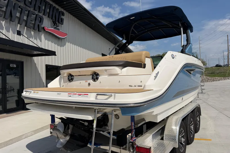Slide: The Image of 2021 Sea Ray SLX 280 boat on trailer outside a yachting center. - 3