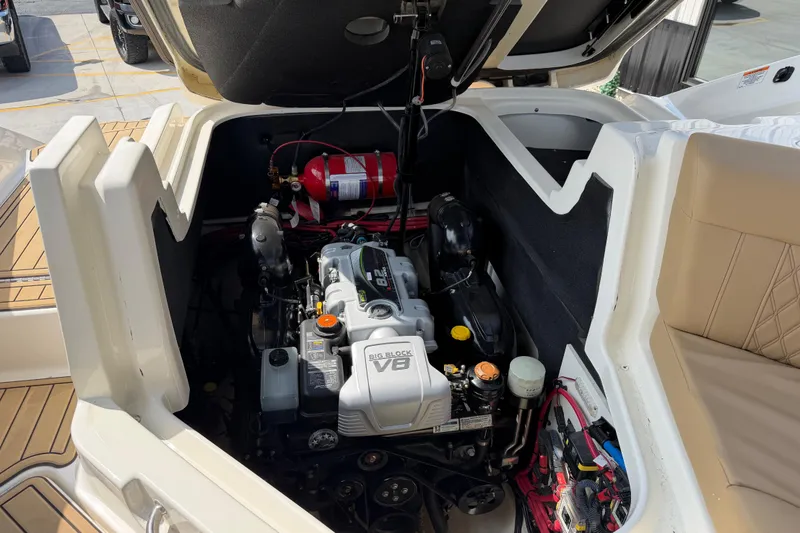 Slide: The Image of Engine compartment of a 2021 Sea Ray SLX 280 boat, featuring a V8 engine. - 31