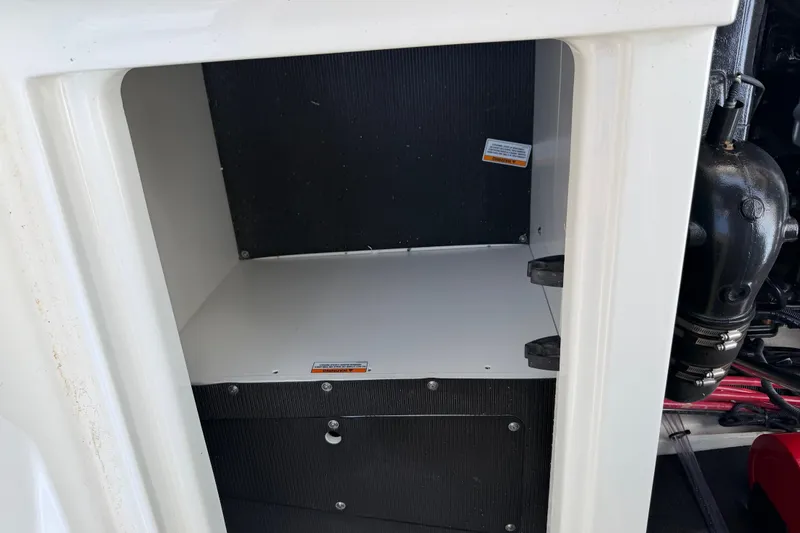 Slide: The Image of Storage compartment of a 2021 Sea Ray SLX 280 boat, showcasing interior details. - 32