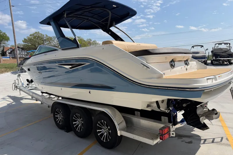 Slide: The Image of 2021 Sea Ray SLX 280 boat on trailer, featuring sleek design and modern amenities. - 6
