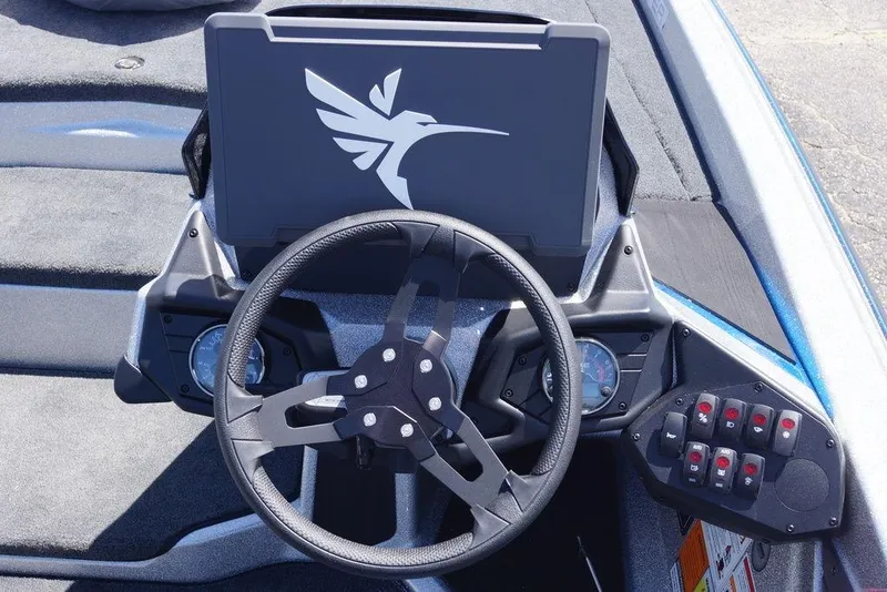 Slide: The Image of Steering console of 2026 Skeeter ZXE21 boat with modern controls and display. - 12