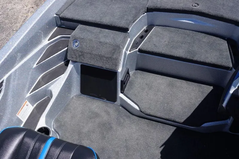 Slide: The Image of Interior view of 2026 Skeeter ZXE21 boat with carpeted flooring and seating. - 18