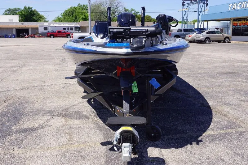 Slide: The Image of 2026 Skeeter ZXE21 boat on trailer in parking lot, front view. - 7