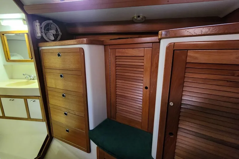 Slide: The Image of Interior of a 1998 Catalina 42 MkII sailboat showing storage and electrical panel. - 19