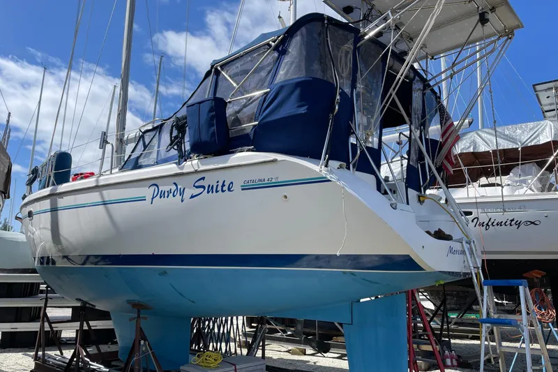 Slide: The Image of Sailboat Catalina 42 MkII 1998 with colorful spinnaker on open water. - 2