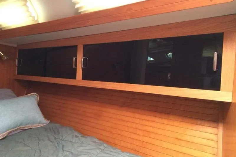 Slide: The Image of Interior cabin of 1998 Catalina 42 MkII sailboat with wooden storage cabinets. - 28