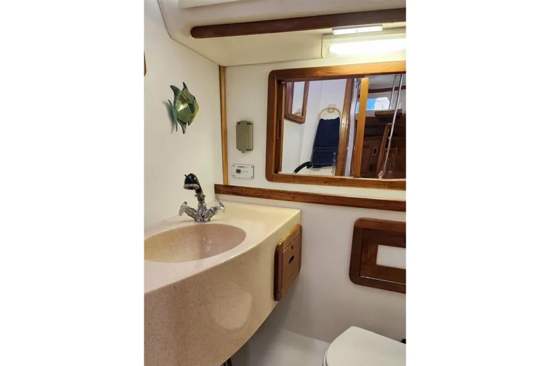 Slide: The Image of Bathroom interior of 1998 Catalina 42 MkII yacht with sink and mirror. - 32
