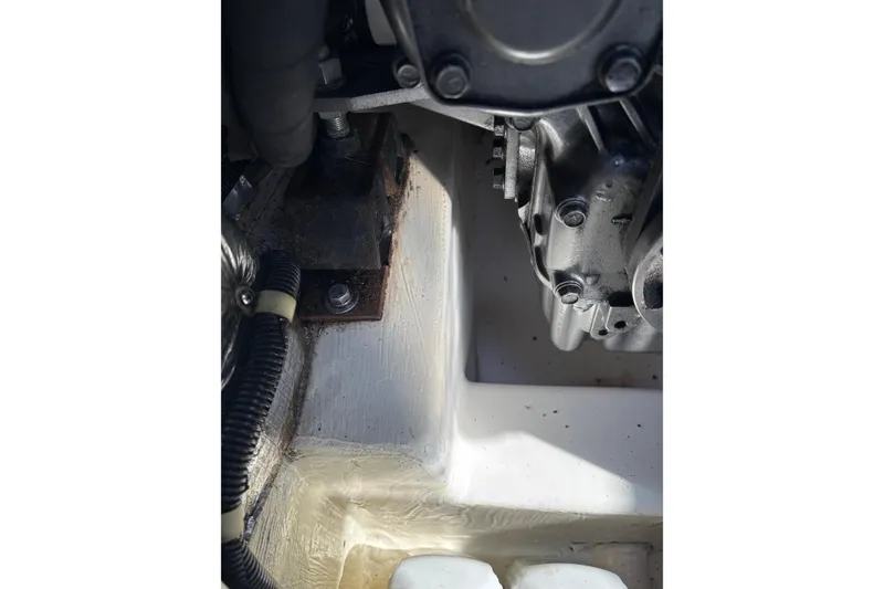 Slide: The Image of Engine compartment of a 1998 Catalina 42 MkII sailboat, showing mechanical components. - 36