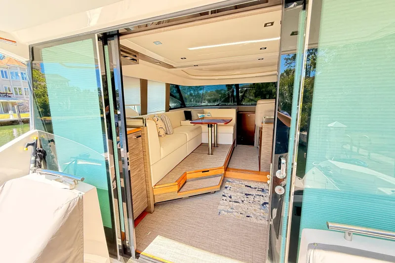 Slide: The Image of Luxurious interior of 2020 Tiara Yachts C44 Coupe with elegant seating and wooden table. - 10